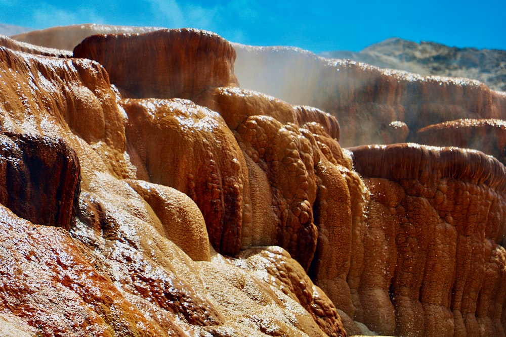 brown rock formation under blue sky during daytime