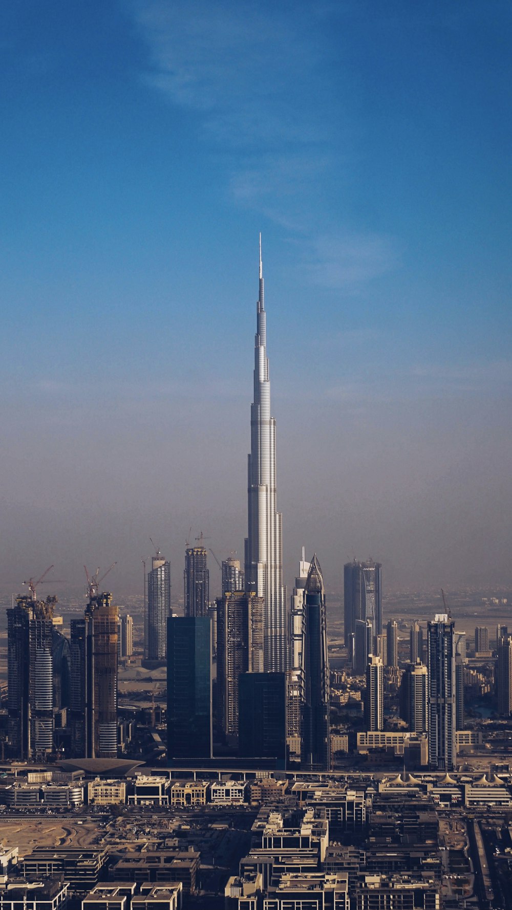 city skyline under blue sky during daytime