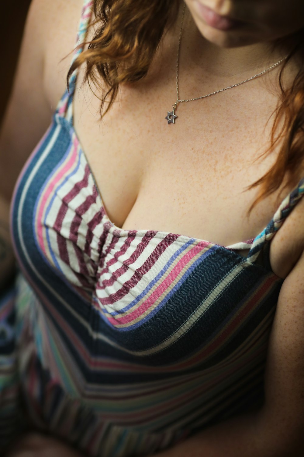 woman in white red and blue stripe tank top