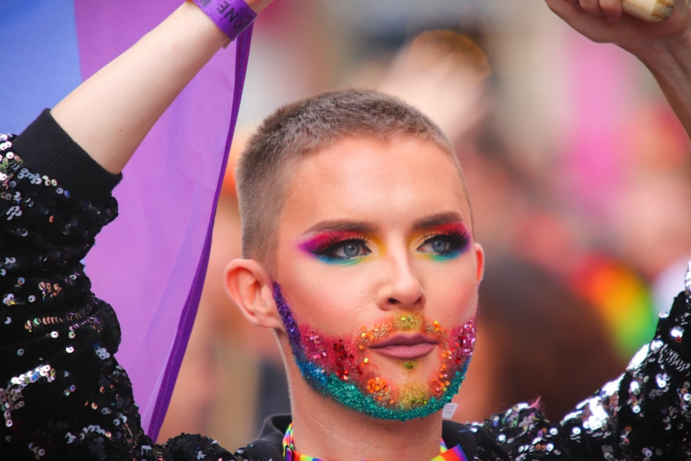 woman with blue and pink paint on face