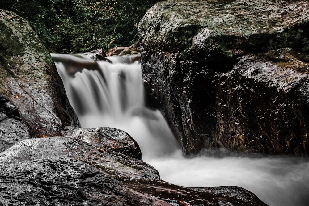 water falls on brown rock