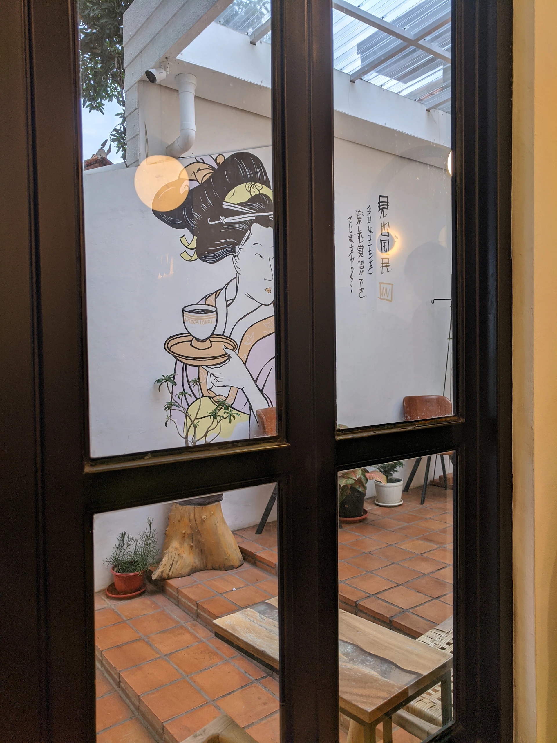 A cozy corner inside the quinta featuring traditional Portuguese tiles and warm natural light filtering through a window.