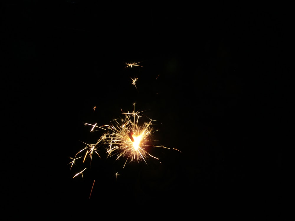 yellow and white fireworks during nighttime