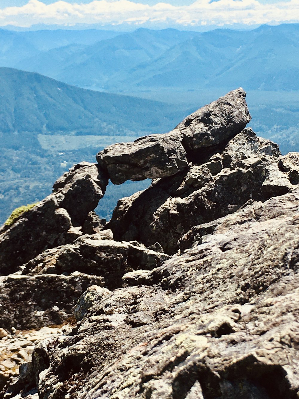 gray rock formation near blue sea during daytime