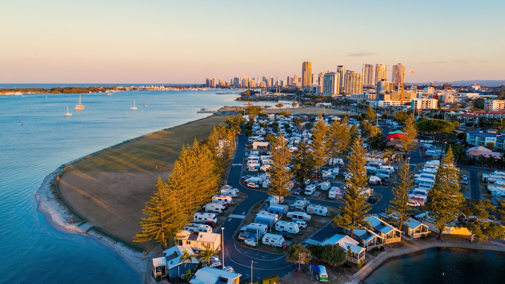 aerial view of city buildings near body of water during daytime