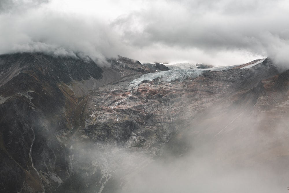 brown and gray mountains under white clouds