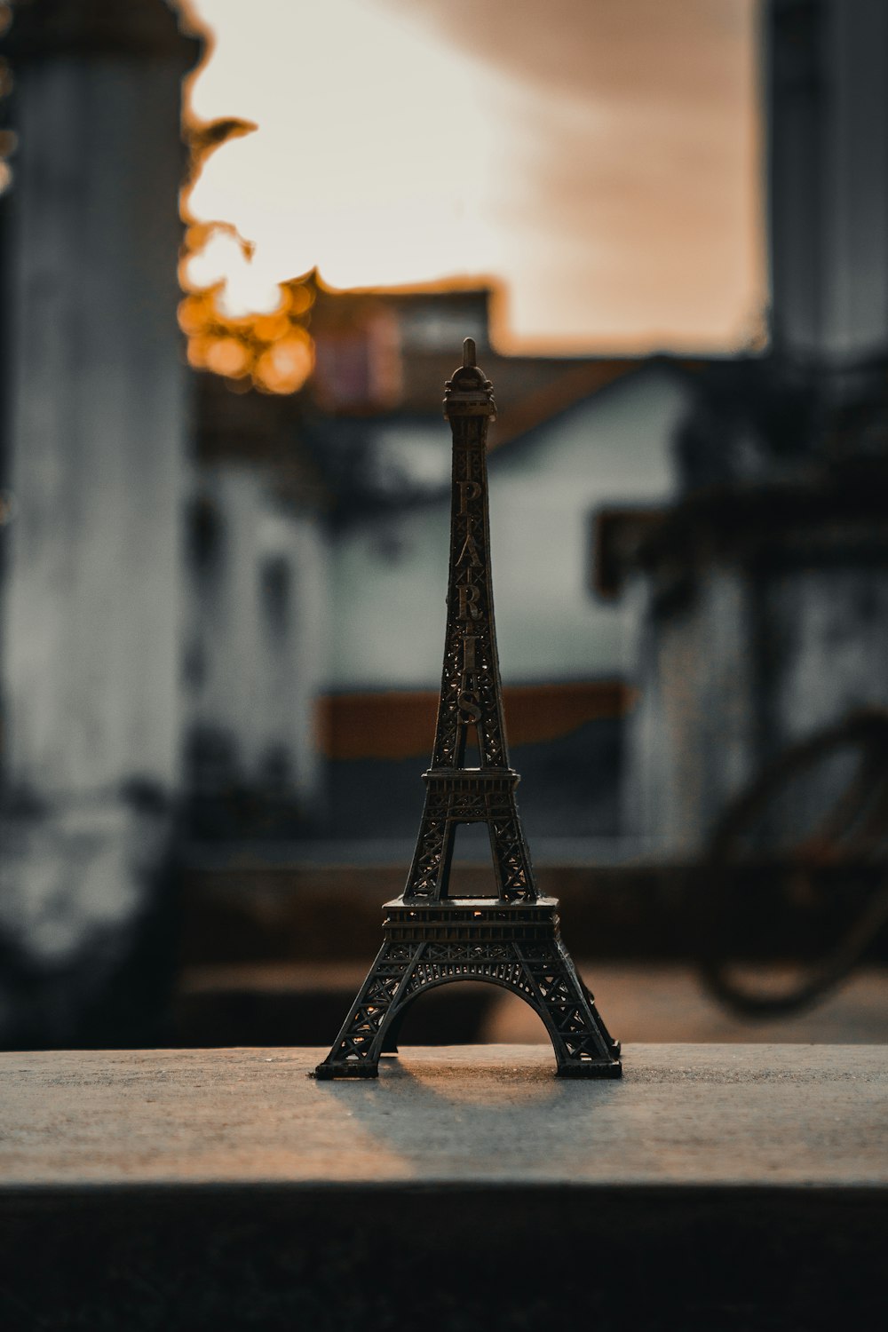 eiffel tower miniature on brown wooden table