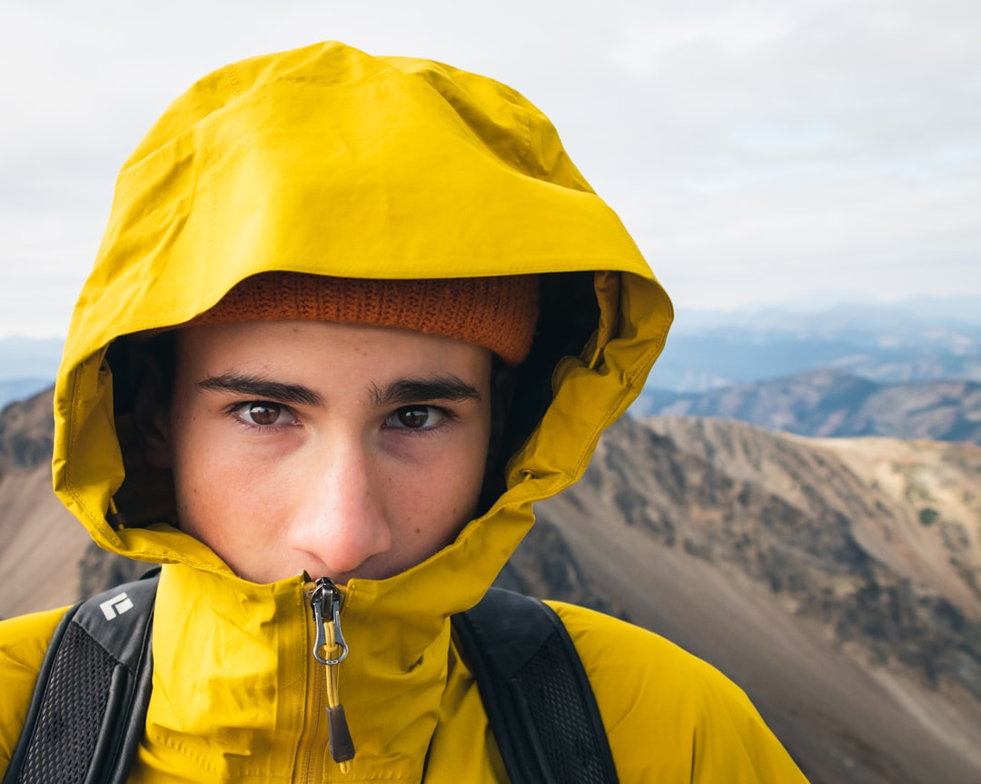 boy in yellow hoodie and yellow cap