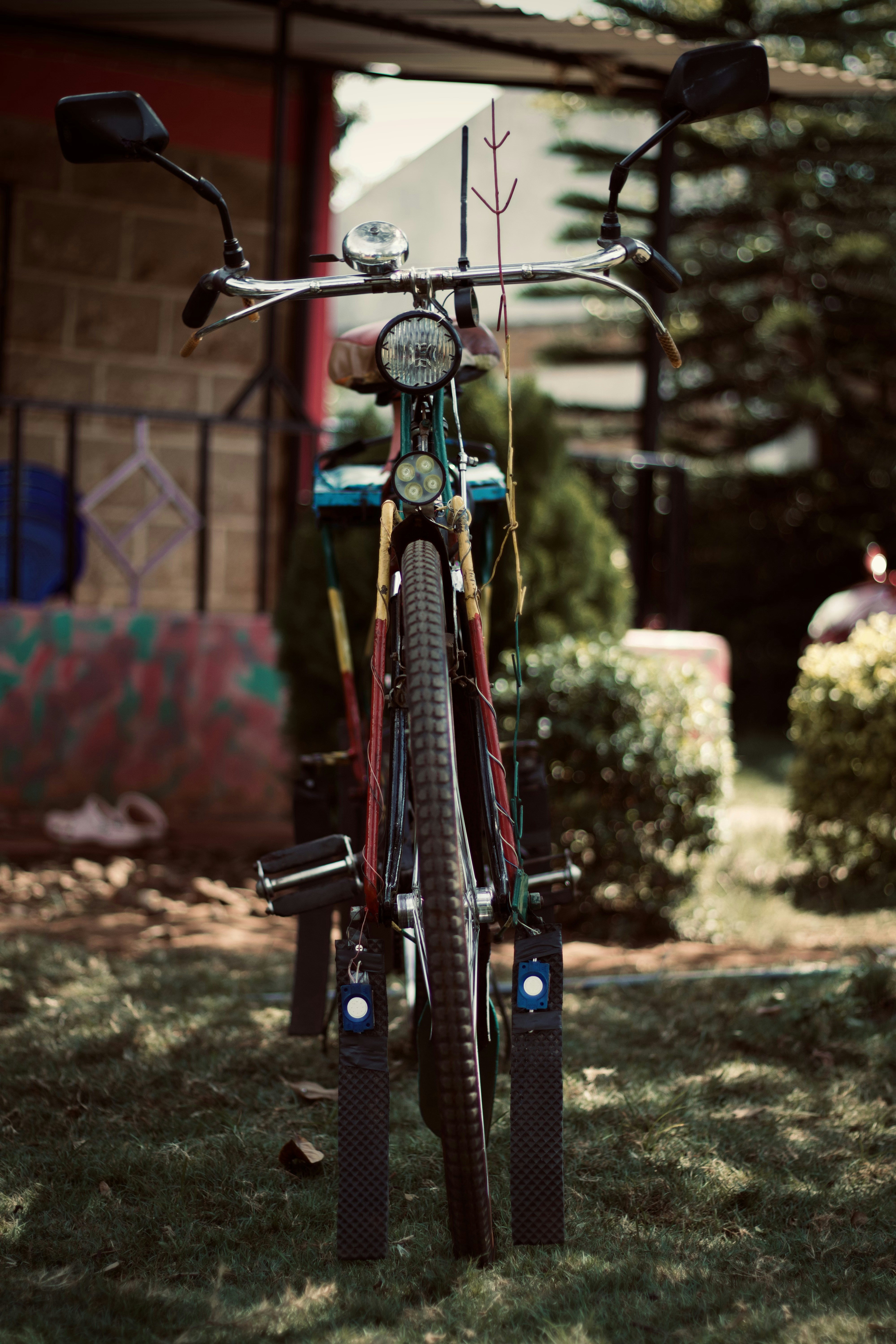 black and gray bicycle with training wheels