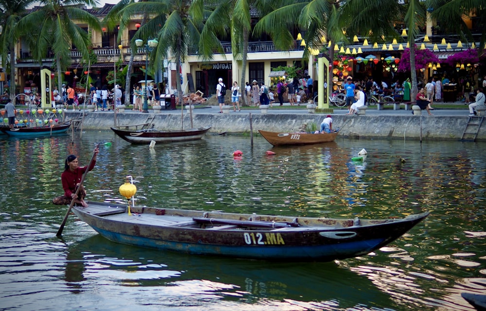 people riding on boat on river during daytime