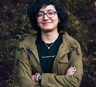 man in brown leather jacket smiling