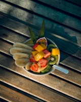 sliced fruits on brown wooden chopping board