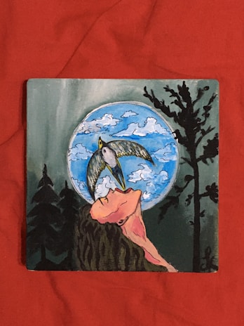 A whimsical drawing of a person with flowing hair drifting through a starry night sky.