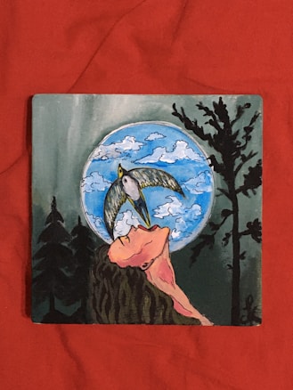 A stylized illustration features a person with long hair gazing upwards, with a bird soaring above their face. In the background, a full moon illuminates the scene, surrounded by wispy clouds. Silhouetted trees frame the composition on either side, adding a mysterious atmosphere.