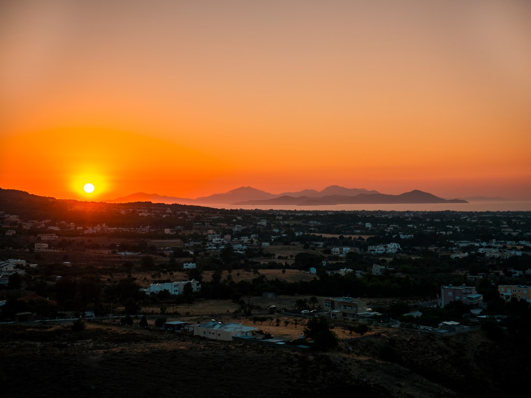 city with high rise buildings during sunset