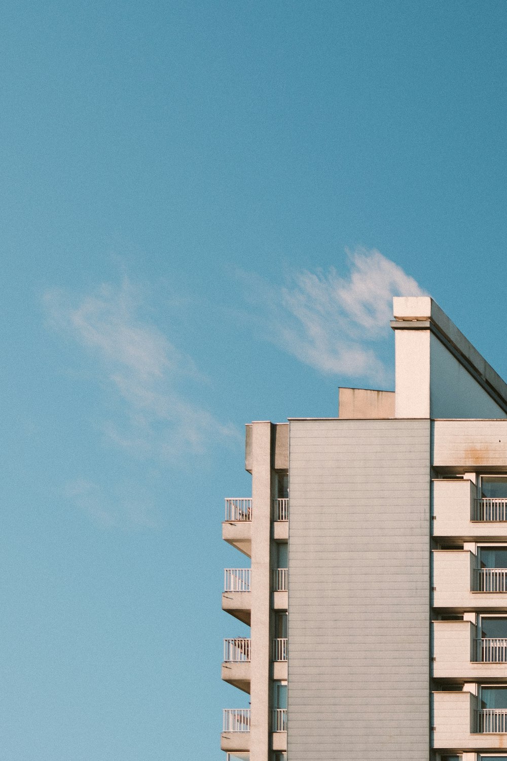 white concrete building under blue sky during daytime