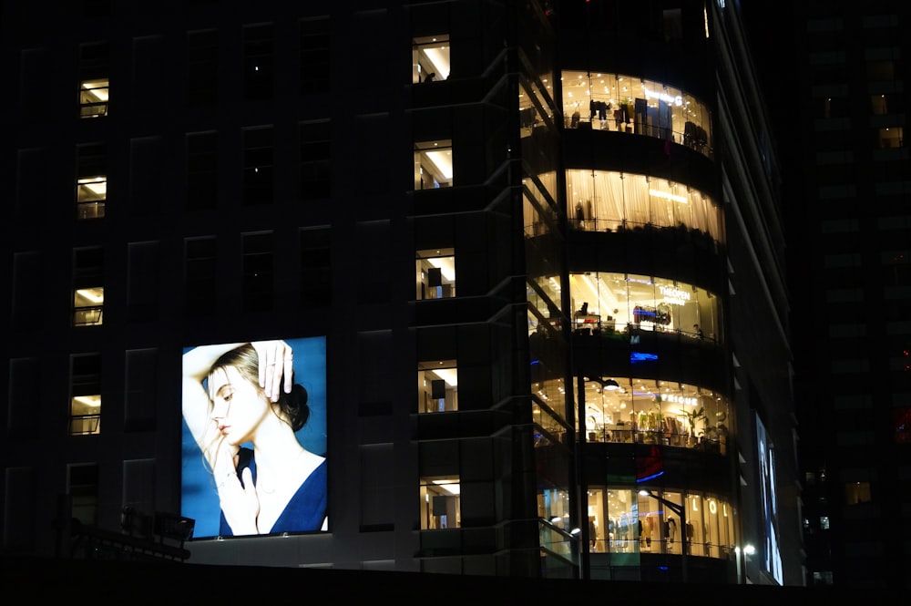 black flat screen tv turned on displaying man in black suit