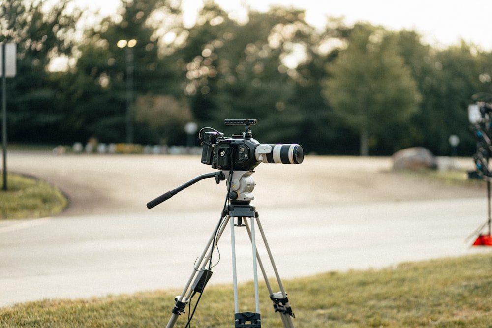 black dslr camera on tripod