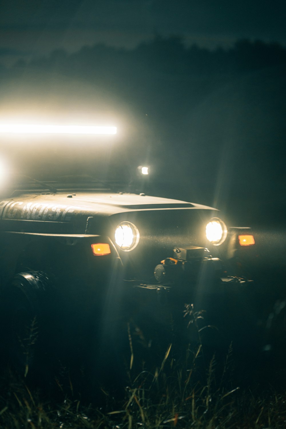 white car on road during night time