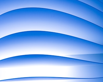 Minimalistic blue and white abstract tech pattern with subtle gradients and rounded shapes.
