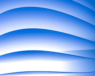 Abstract blue gradient background with soft light waves symbolizing calm and focus.
