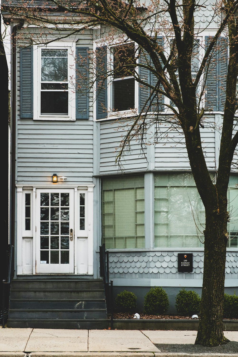 white wooden house with white wooden window