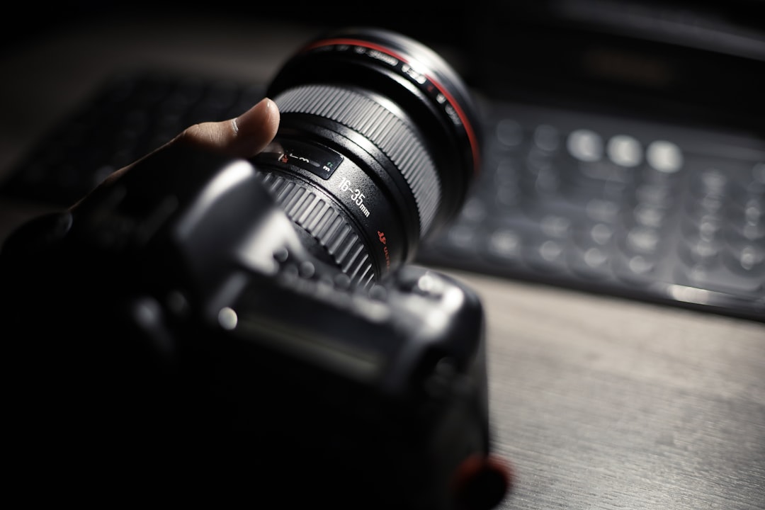 black camera lens on black computer keyboard