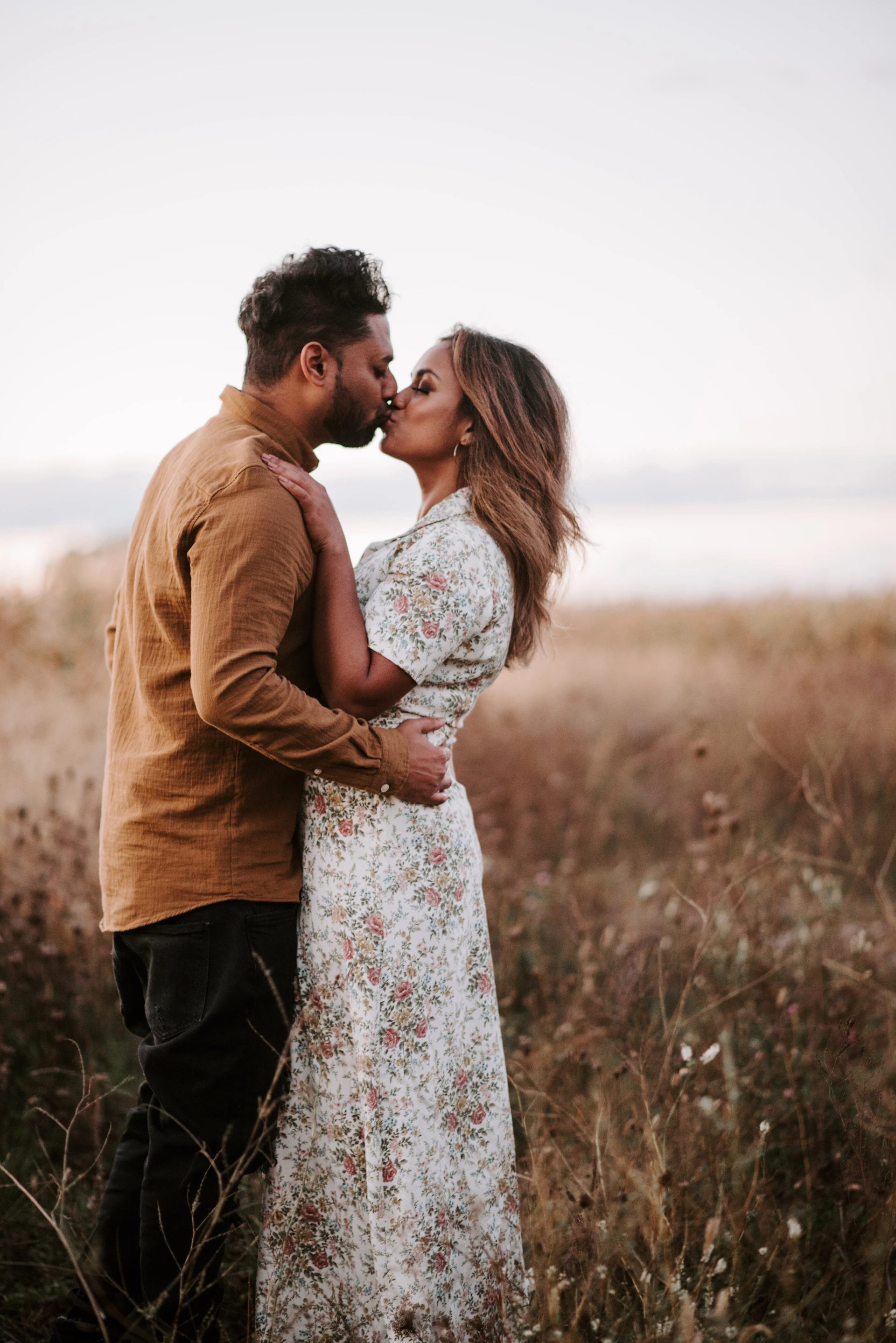 man and woman kissing during daytime