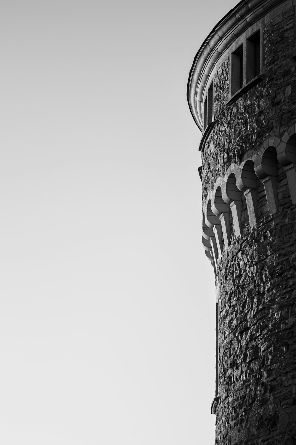 a tower that has a sign on the side of a building