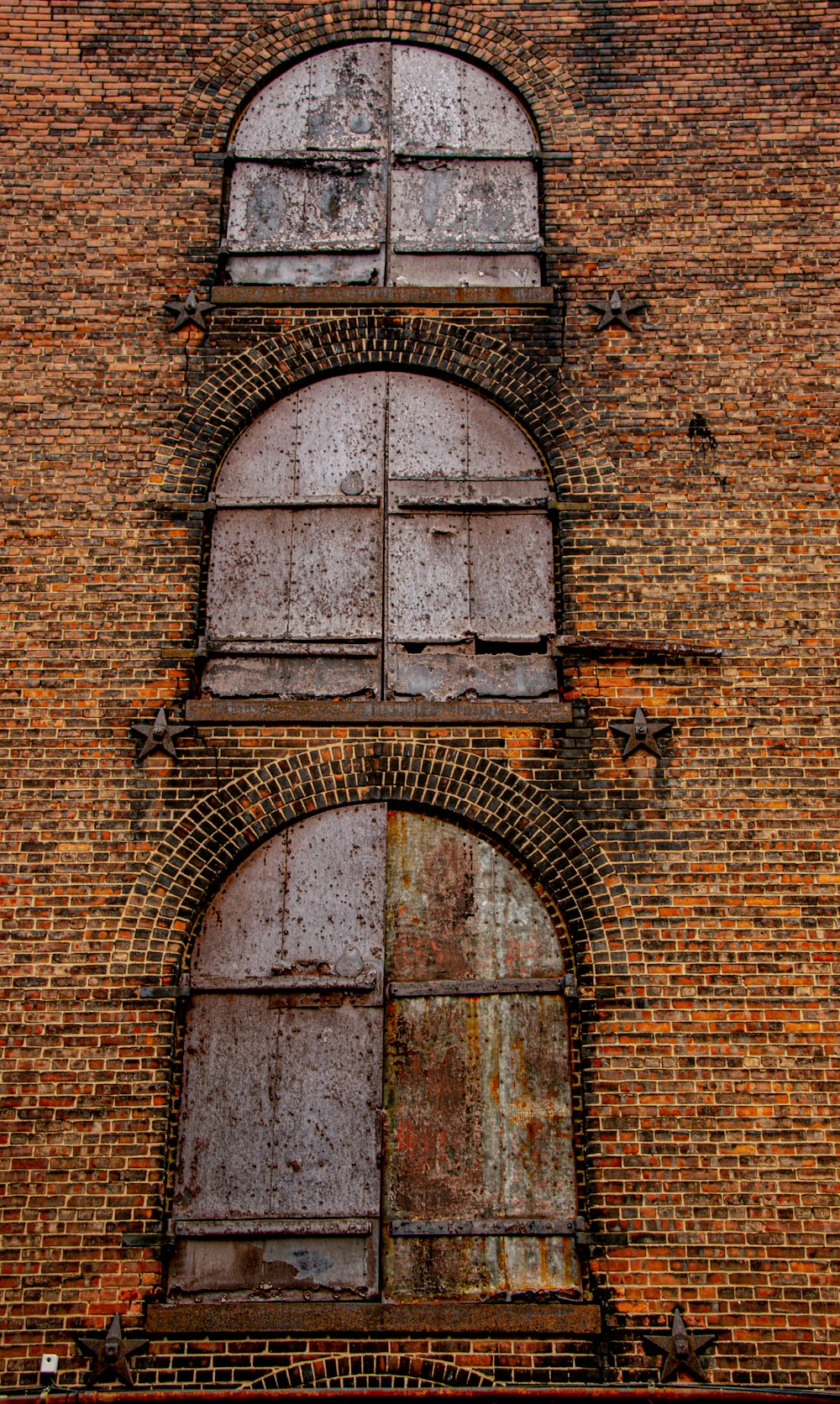 brown brick wall with brown wooden door