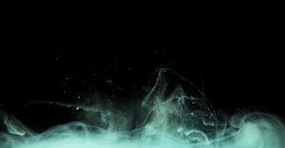 A mysterious velvet-black gradient background with subtle indigo and gold accents swirling like cosmic energy.