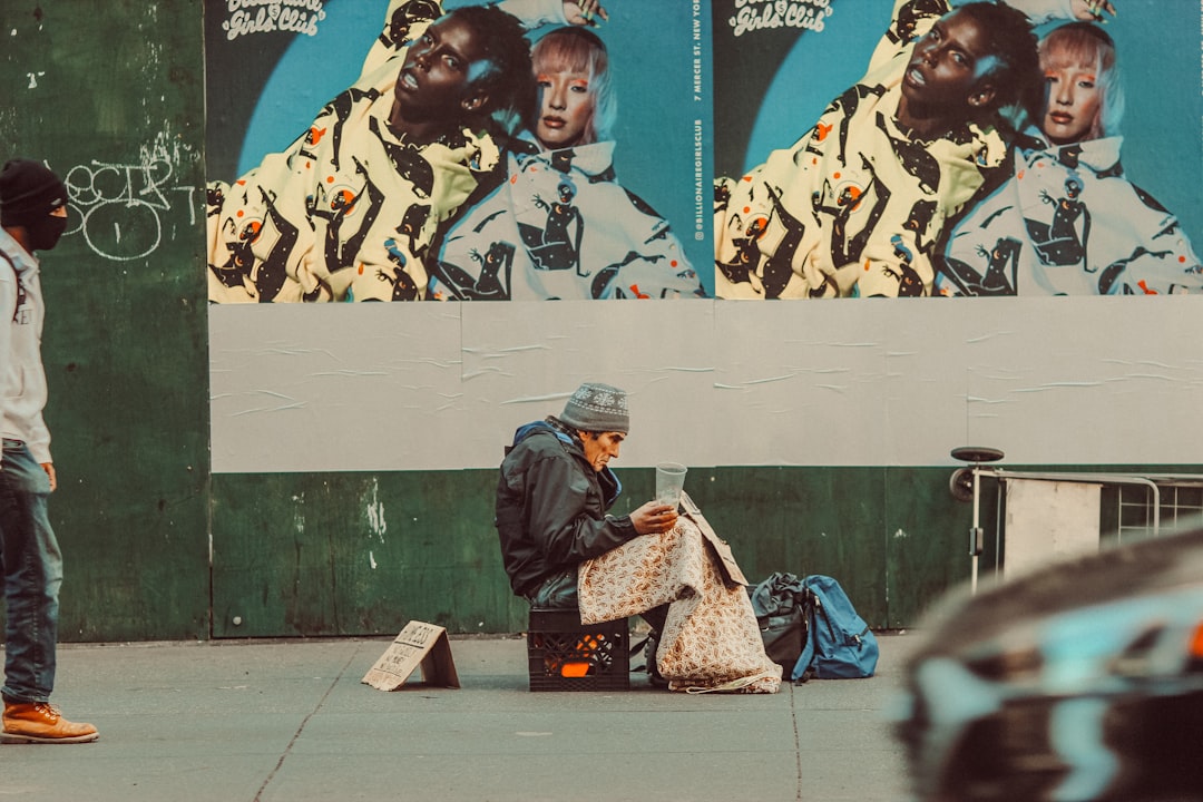 woman in black and brown coat sitting on bench