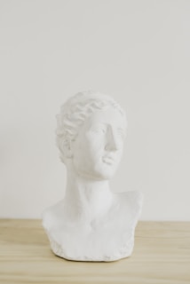 Close-up of a marble bust with a headset, symbolizing attentive customer support.