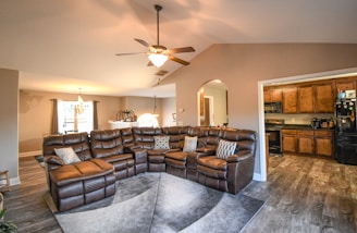 A luxurious leather sectional in a spacious room.