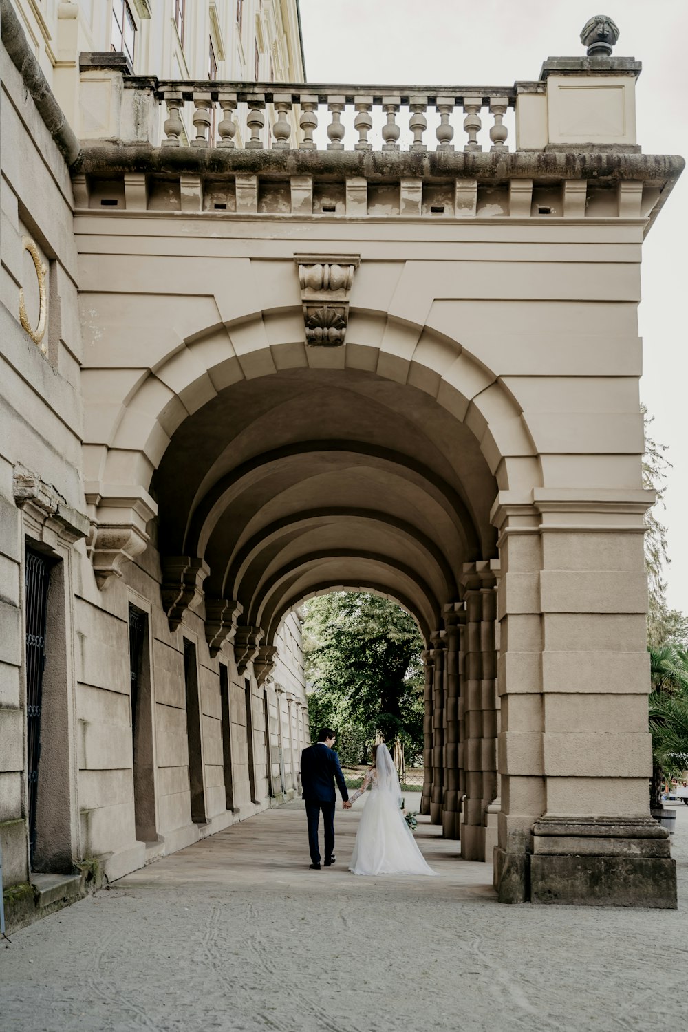 couple walking on hallway during daytime