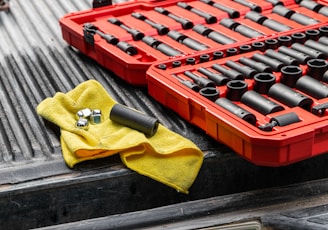 yellow textile on red and black plastic crate