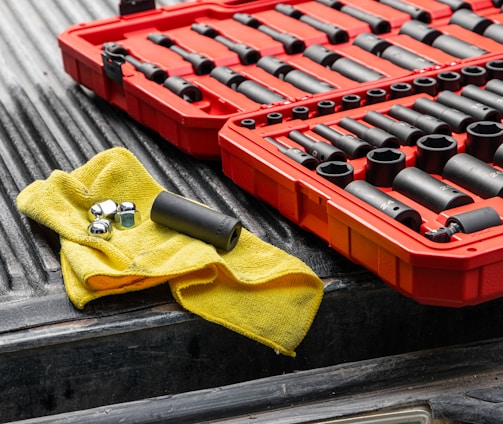 yellow textile on red and black plastic crate