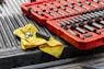 yellow textile on red and black plastic crate