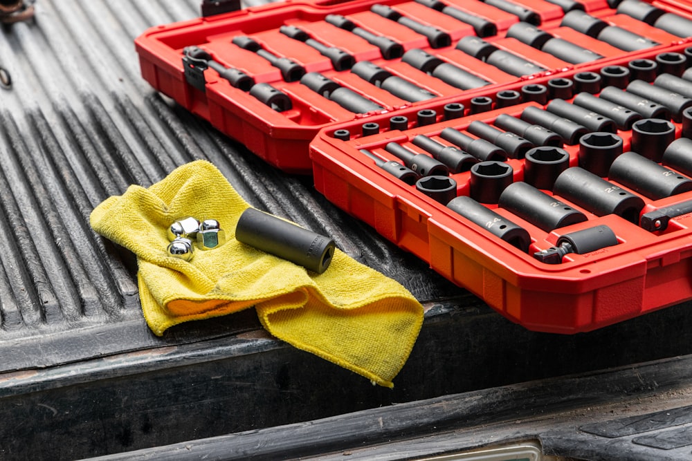 yellow textile on red and black plastic crate