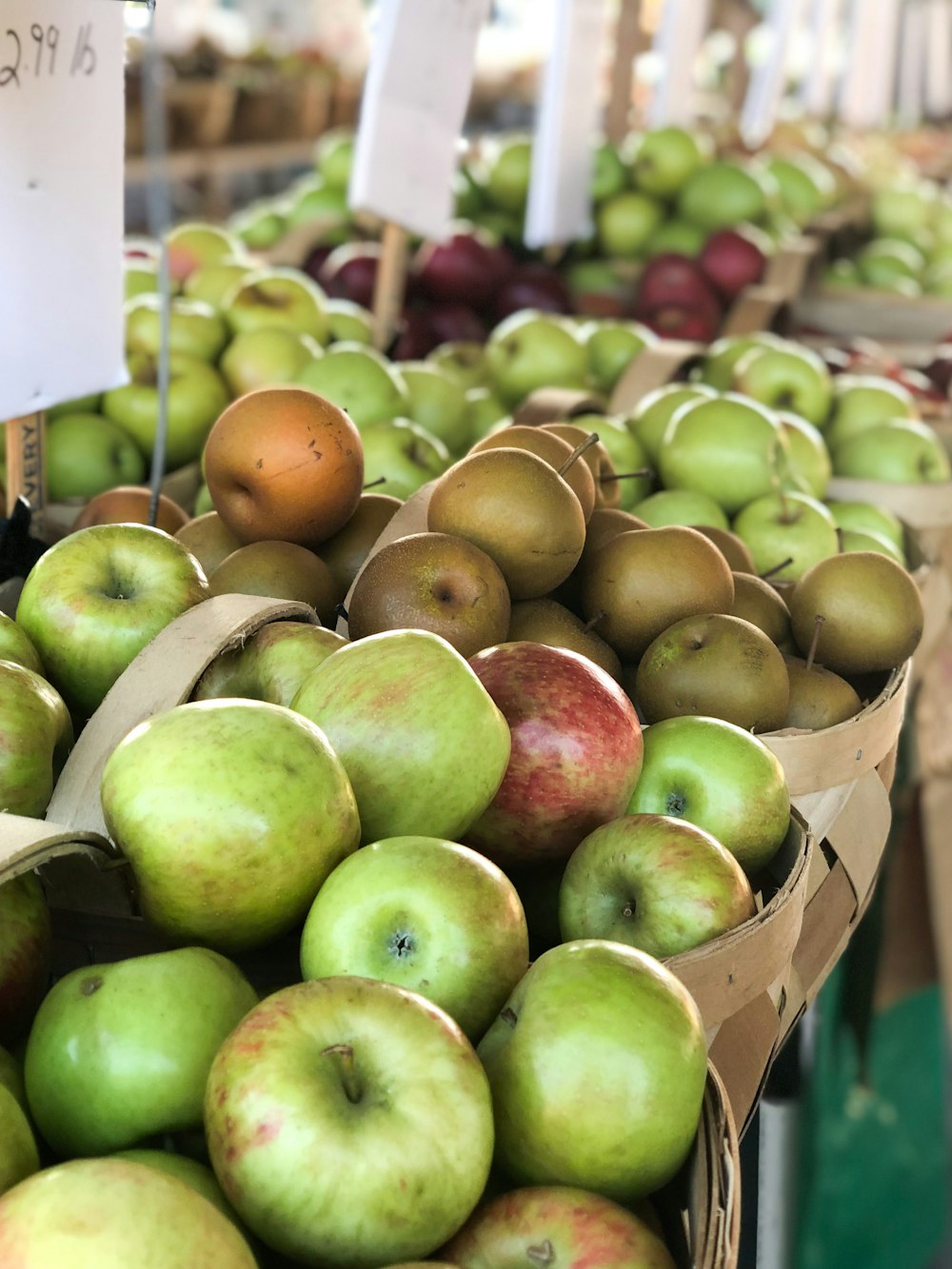 green and red apples in green plastic containers