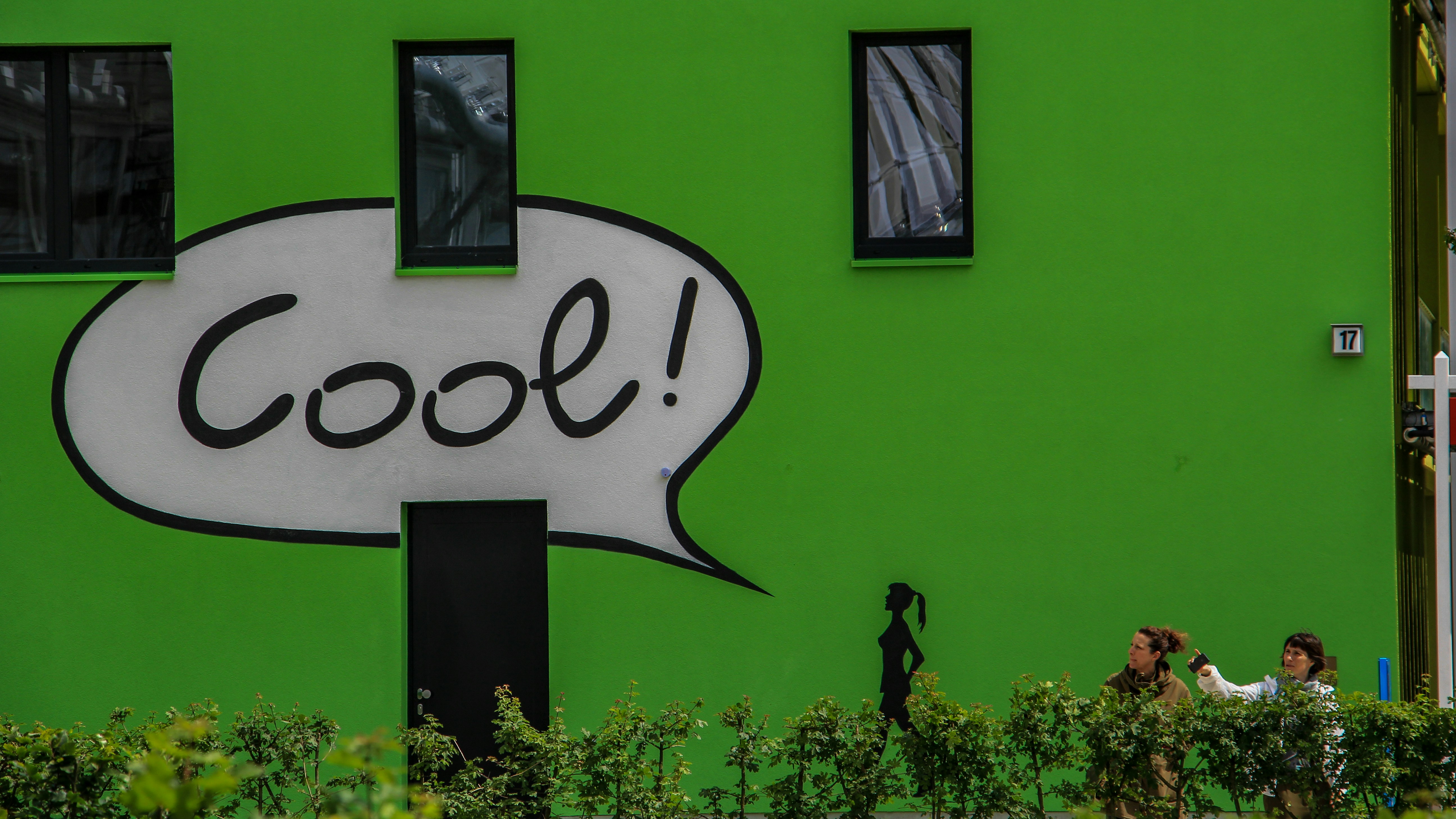 Designer working on AI avatar character creation for spoken dialog on digital tablet