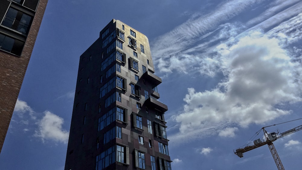 brown concrete building under blue sky during daytime