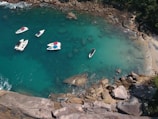 white and red boat on water during daytime