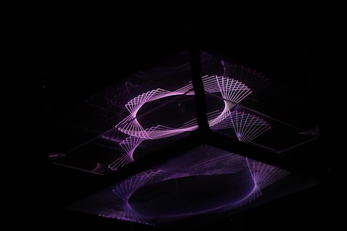 Abstract digital brain with circuits pulsing in neon purple against a dark background.