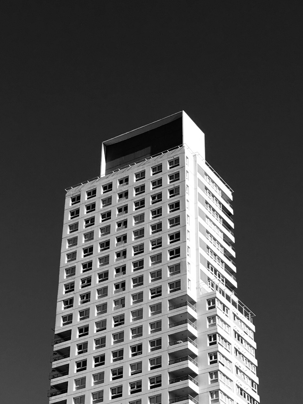 grayscale photo of high rise building