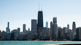 high rise buildings near body of water during daytime