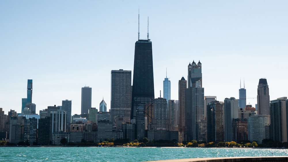 high rise buildings near body of water during daytime