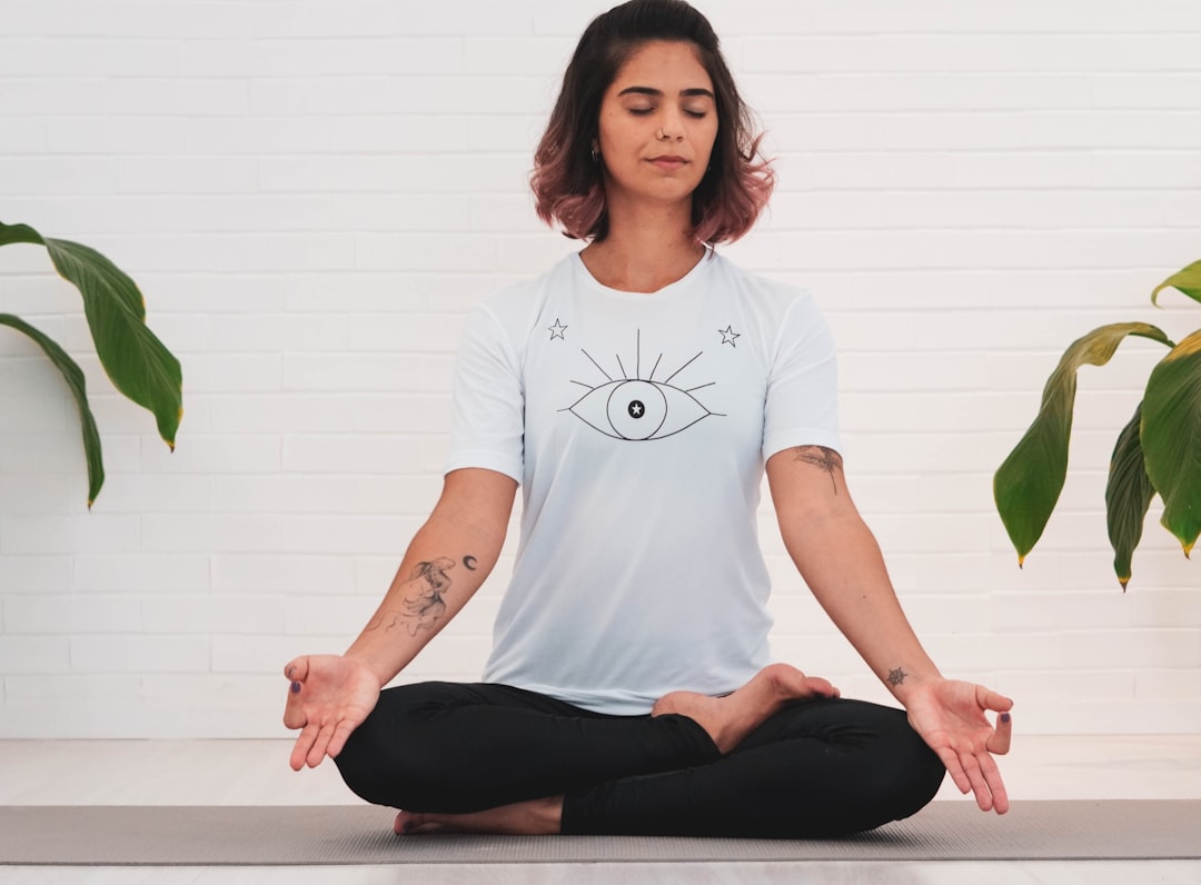 woman meditating while doing yoga - Practice Deep Breathing Exercises