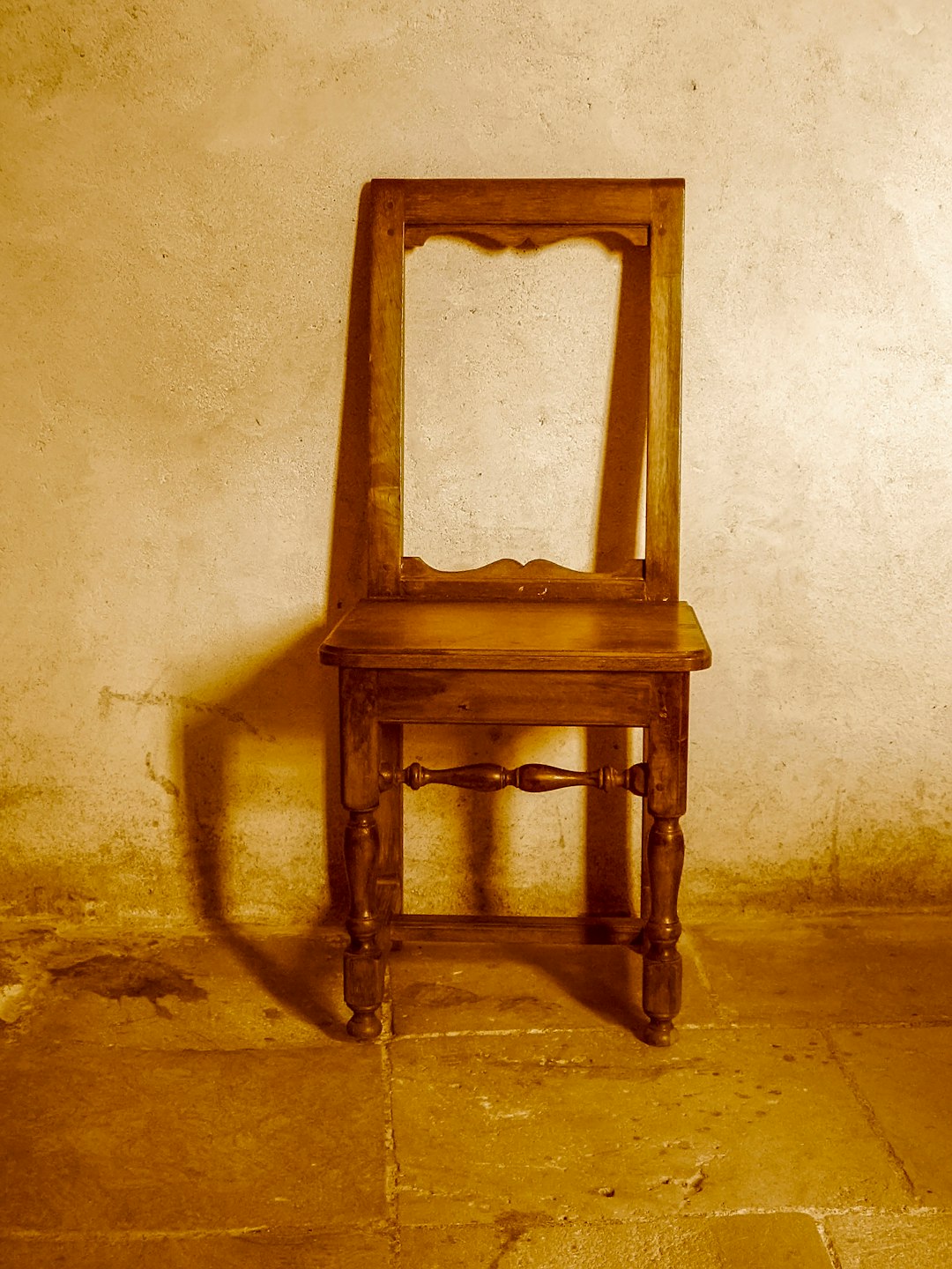 brown wooden table on gray concrete floor