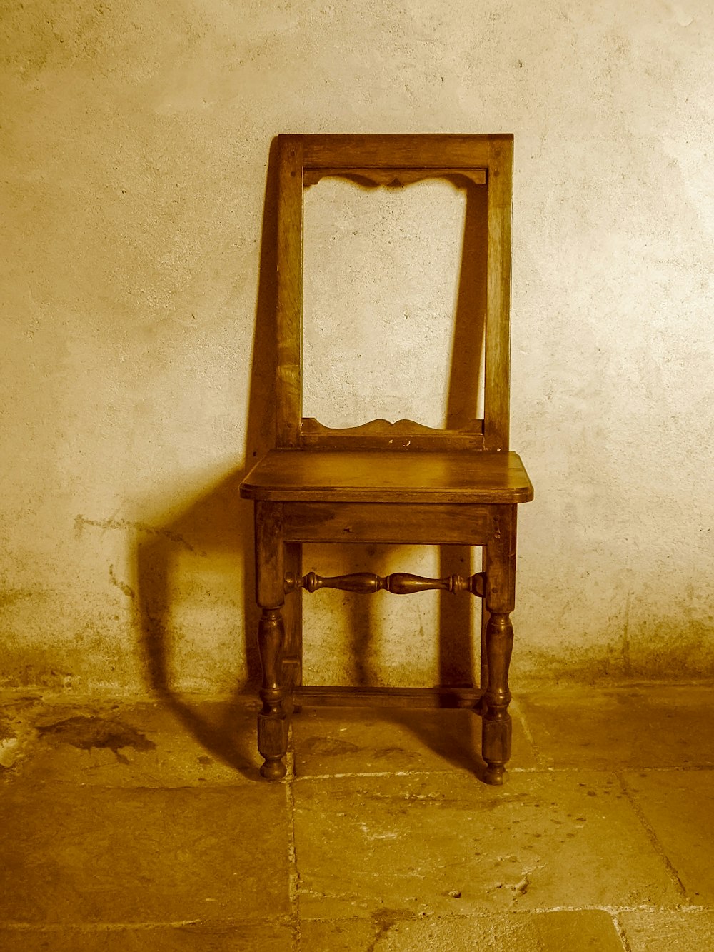 brown wooden table on gray concrete floor